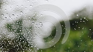 Water drops of rain on car windshield