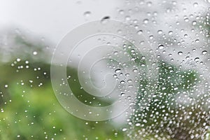 Water drops of rain on car windshield