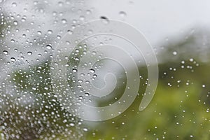 Water drops of rain on car windshield