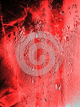 Water drops red background