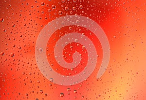 Water drops on red gradient background. Love, passion, heart, desire, action, romance concept.