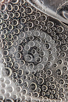 Water drops on transparent glass background.