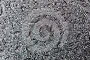 Water drops on a waterproof surface. drops of water on a car. silver background made of drops on metal