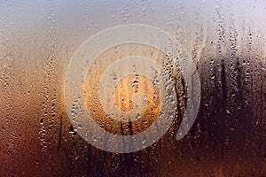 Water drops on a window, on a cold winter morning