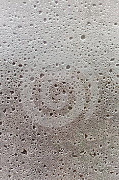 Water drops on the window. Droplets background. Water on glass surface. Condensation texture.