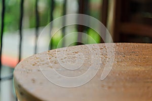 Water drops on wooden surface table - droplets of raindrop. background