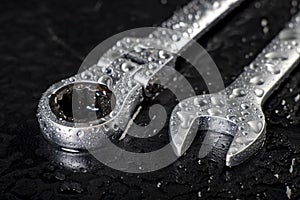 Water drops on workshop wrenches. Wet tools used in a machine shop photo