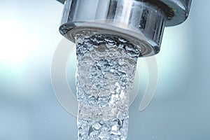 Water economy concept. Open tap, consumption, closeup. photo