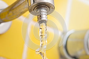 Water economy concept. Open tap, consumption, closeup. photo