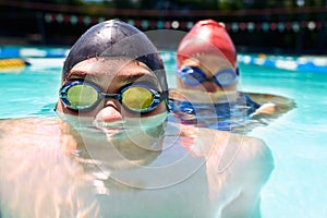 Water, faces or people in swimming pool for sports training, workout or activity for fitness together. Friends, swimmers