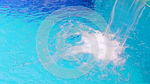 Water Falling into Swimming Pool