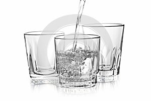 Water falling in Three glass on isolate background