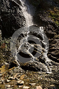 Water falls over rocks in the Black Hills