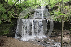 Water Falls Three Times Over Stone Ledges