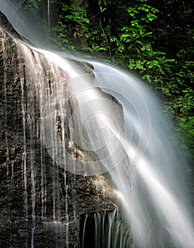 Water falls violently over rocks