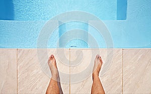 Water, feet and pov of man at a pool for swimming, leisure and summer, fun and relax. Barefoot, swimmer and legs of male