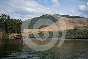 Water ferries traveling through port wine country Portugal. Douro valley