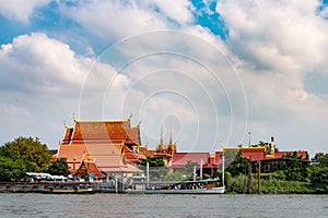 Water ferry with people at temple.