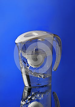 Water filter on blue background