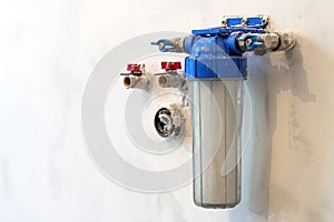 Water filter new installed on a kitchen wall to purify drinking