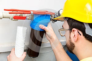 Water filtration - plumber changing water filter