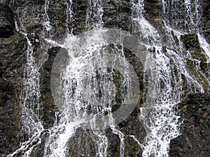 Water flowing on cascade photo