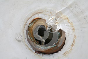 Water flowing through the drain hole