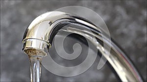 Water flowing from a kitchen faucet