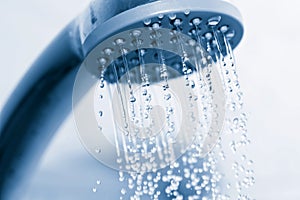 Water flowing from metal shower