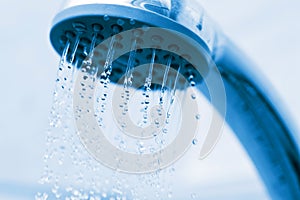 Water flowing from metal shower