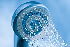 Water flowing from metal shower