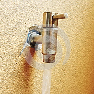 Water flowing from modern faucet