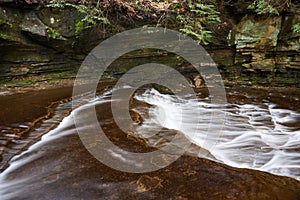 Water Flowing near a Natural Rock Wall