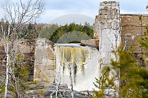 Water Flowing Over A Broken Dam