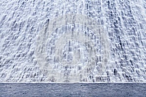 Water flowing over a dam