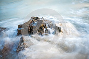 Water flowing over a detailed rock formation in the atlantic ocean