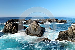 Water flowing over lava rocks in Tenerife, Spain