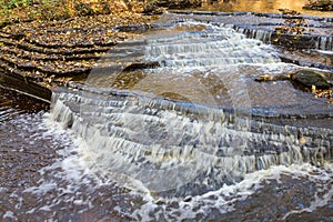 Water flowing over the shale rock in the river