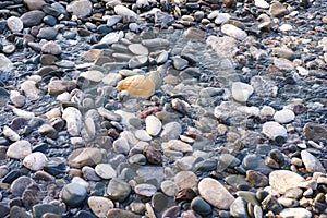 Water flowing through sea pebbles