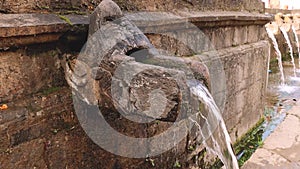 Water Flowing From Stone Spout In Holy Place Matatirtha