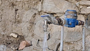 water flowing from the tap in vain and wastage of water, pressurized water from the tap