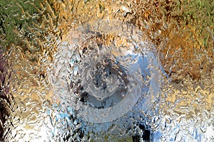 Water flows along the wall of the mirror, horizontal abstract texture, shiny background