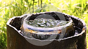 Water flows out of a pipe located vertically slowly.