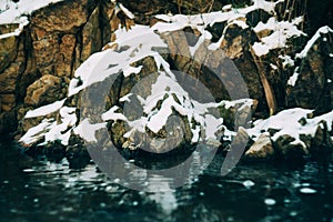 Water flows over a partially frozen Upper Cataract Falls in rural Indiana.