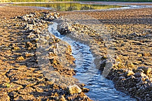 Water flows into the pond shrinking