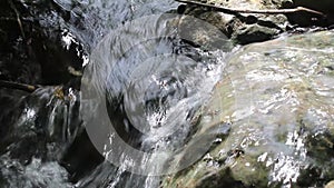 Water flows swiftly between the rocks