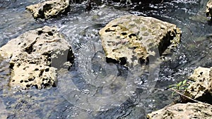 Water flows swiftly between the rocks