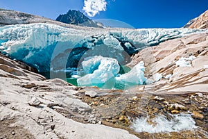 Water flows under the Aletsch glacier, which melts