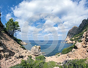 Water foreground with turquoise clear water of the Mediterranean Sea on the tourist resort of Sant Elm, Mallorca, Spain