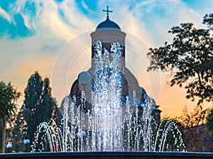 Water fountain fits in the contour of church